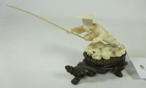 19th / Early 20th Century Chinese ivory figure of a fisherman on carved wood plinth. H. 9.