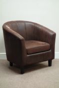 Tub shaped armchair upholstered in brown suede type fabric, ebonised feet,