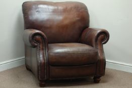 Club armchair upholstered in brown leather with stud detail,