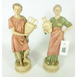 Pair of Royal Dux figurines of male and female water carriers,