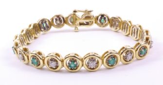 Gold halo link bracelet set with round cut emeralds and brilliant cut diamonds stamped 14k