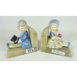 Pair of Art Deco alabaster bookends mounted with pottery boy & girl figures (2) Condition