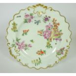 18th Century Chelsea hand painted plate with floral decoration and gilt moulded scrolls,