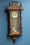 Early 20th century walnut Vienna clock, twin train movement striking the hours on a gong,