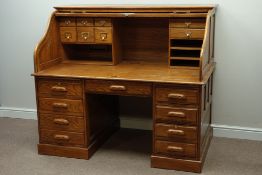 Large oak twin pedestal desk, tambour roll top, three drawers and cupboard, with fitted interior,