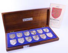 A set of 12 `Royal Arms` hallmarked silver Shields in celebration of Queen Elizabeth II Silver