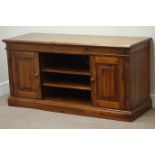 Pine television stand fitted with two cupboards and centre shelves, W126cm, H62cm,