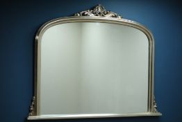 Silver framed overmantle mirror, ornate pediment,