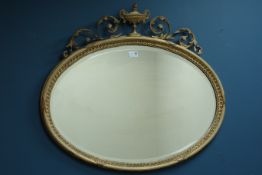 19th century Adams style gilt wood and gesso framed oval bevelled mirror,