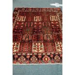 Persian rug, multiple square geometric design with stylised tree of life motifs,