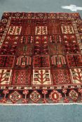 Persian rug, multiple square geometric design with stylised tree of life motifs,