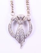 Diamond set platinum pendant on later hallmarked silver chain Condition Report