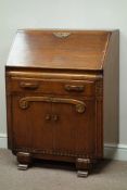 Mid 20th century medium oak bureau, fall front (hinge broken), single drawer and cupboard, W76cm,