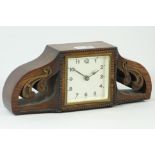 Art Deco mantle clock, square dial in pierced scroll carved oak case,