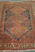 Antique Persian Shiraz rug, three diamonds within large blue ground lozenge,