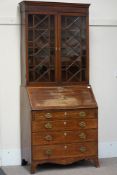 Early 19th century mahogany fall front bureau bookcase with shell inlay, four graduating drawers,