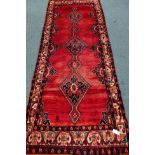 Persian Hamadan red ground rug, triple lozenge pole medallion,