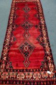 Persian Hamadan red ground rug, triple lozenge pole medallion,