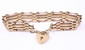Gold four bar gate bracelet with heart shaped padlock and safety chain hallmarked 9ct approx 10gr