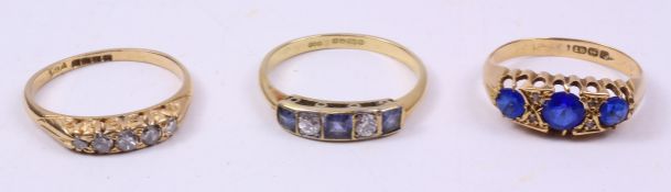 Gold ring set with three square cut sapphires and two brilliant cut diamonds hallmarked 18ct;