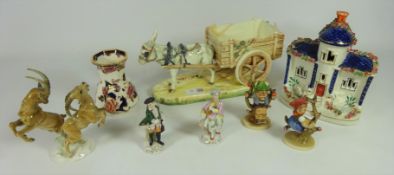 Royal Dux Figure of a Donkey pulling a Cart, Hutschenreuther fighting rams, two Hummel figures,