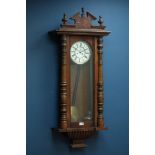 Late 19th century walnut Vienna wall clock with circular dial, twin weight movement,