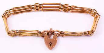 Edwardian rose gold three bar gate bracelet stamped 9ct with heart shaped lock 8gr