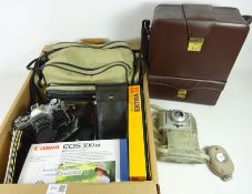 Canon EOS 300 camera, Canon AE-1 with 50mm lens, Vintage Kodak ektra 12 camera,