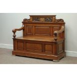 Edwardian golden oak hall bench with fielded panels, the back with leaf carved dentil cresting,