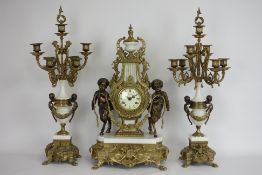 20th century gilt metal & marble clock garniture, circular dial set with two fauns with a garland,