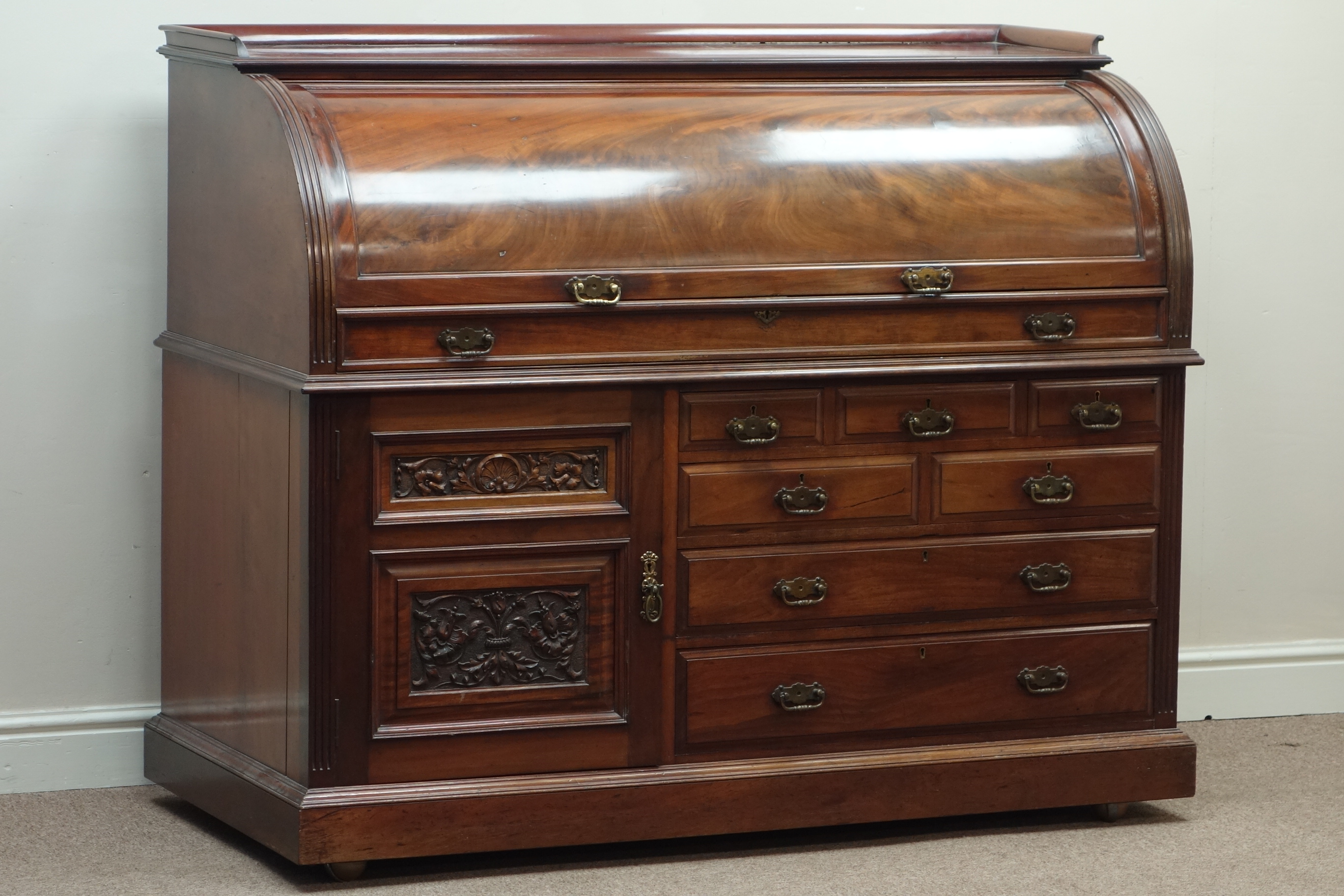 Late Victorian mahogany cylinder top desk, multiple drawers and carved panelled cupboard, - Image 3 of 3