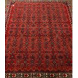 Hamadan red ground rug carpet field repeating geometric motifs within a chevron and stylized floral