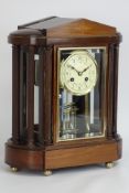 Edwardian mahogany four glass portico clock with floral enamel porcelain dial,