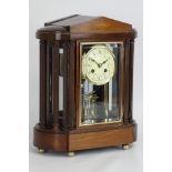 Edwardian mahogany four glass portico clock with floral enamel porcelain dial,