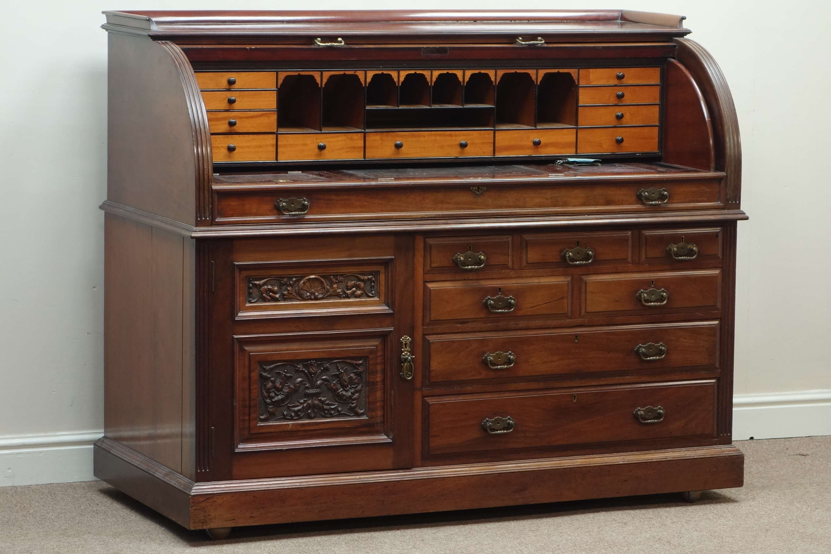 Late Victorian mahogany cylinder top desk, multiple drawers and carved panelled cupboard, - Image 2 of 3
