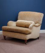 Howard & Sons armchair, turned walnut front feet, upholstered in pale gold cover,