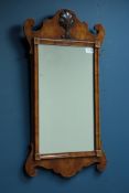 Chippendale style figured walnut mirror with carved shell motif,