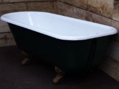 Cast iron roll top bath with ball and claw feet,