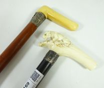 Late 19th/ early 20th Century walking stick with carved ivory handle of lion on rock work with