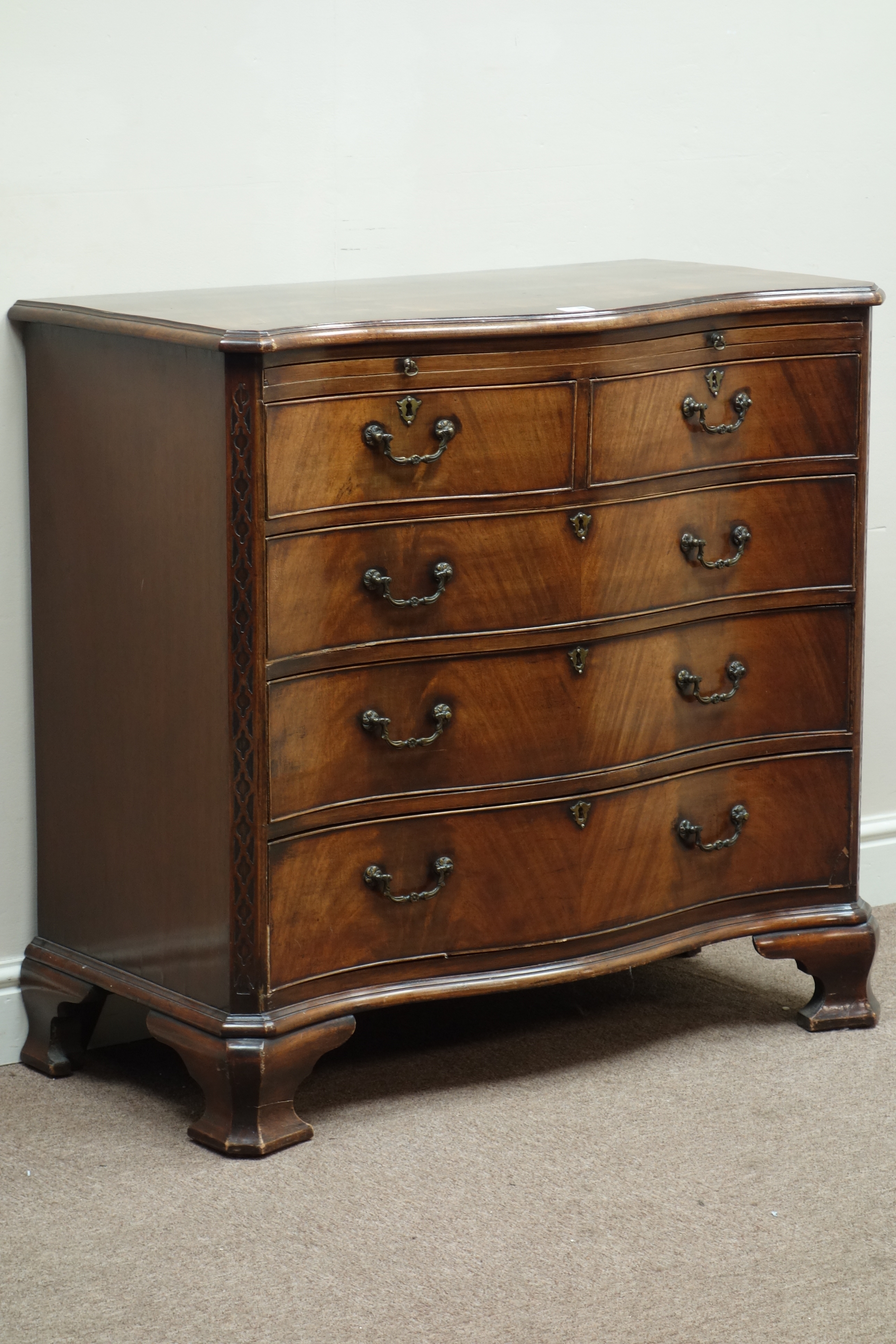 Early 20th century mahogany and walnut banded serpentine chest,