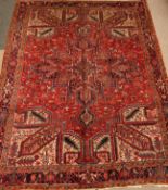 Large Persian Heriz red and blue ground rug carpet, geometric design,