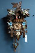 Black Forest style carved wood and painted cuckoo clock,
