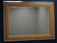 Light oak and chrome framed mirror with bevelled glass,