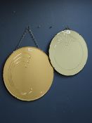 20th century circular copper tinted frameless mirror and another similar frameless mirror