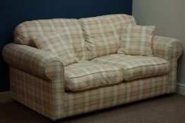 Two seat metal action sofa bed upholstered in pale checkered fabric,