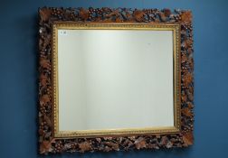 Late 19th century walnut framed mirror, carved with field mice, leaves and berries,