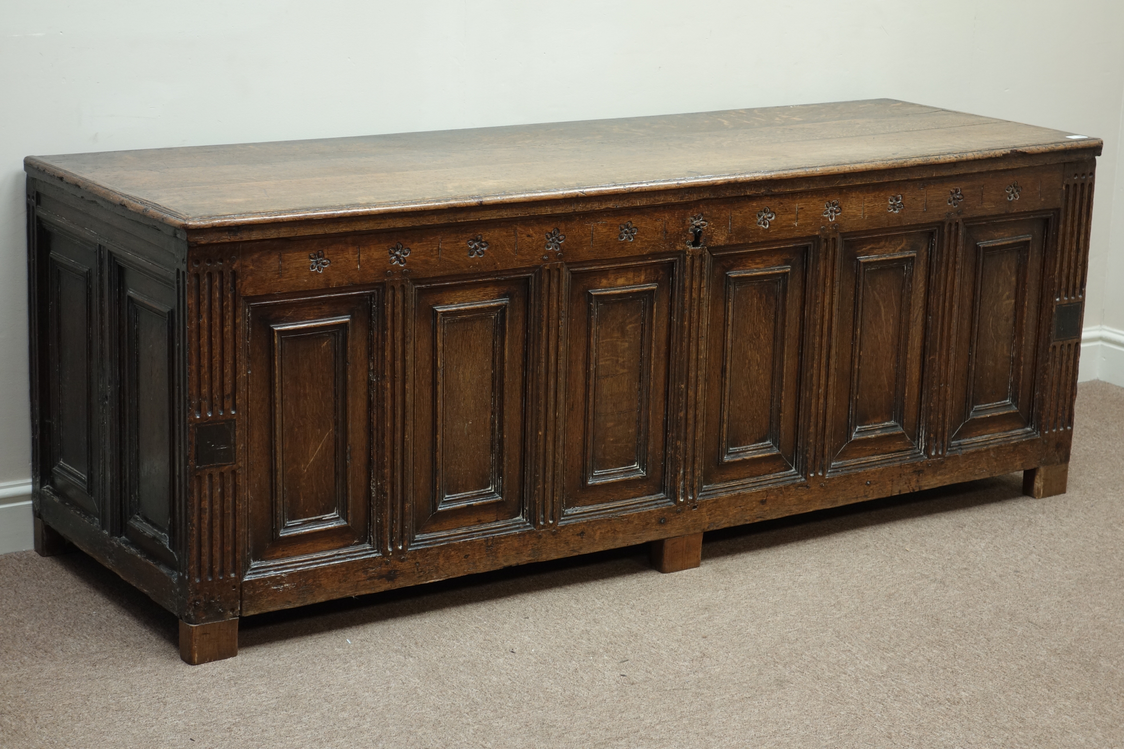 Large 18th century oak six fielded panel blanket box, hinged lid, fluted supports,