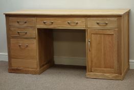 Light oak knee hole desk, four drawers and cupboard, centre fall front keyboard drawer, W157cm,