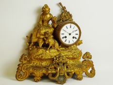 Late 19th century gilt metal mantel clock, seated maiden with dog,