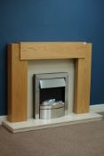 Contemporary fireplace comprising of - oak surround with granite hearth and inset with fuel effect
